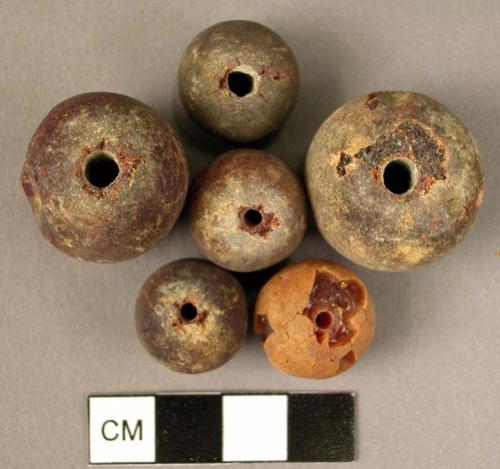 Disk-shaped amber beads of various sizes