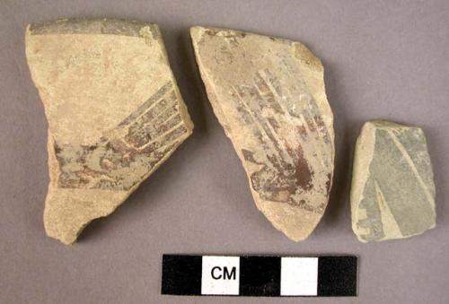 Ceramic body sherds, white slipped with red or black painted geometric design