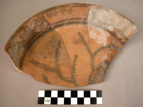 Pottery plate fragment - black on red (B1)