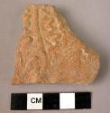 Potsherd - red-brown, relief, incised