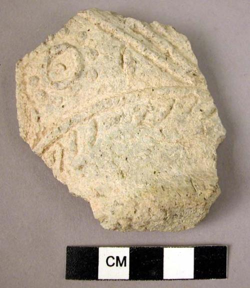 Base potsherd - light colored, moulded relief