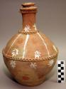 Earthenware complete vessel with stopper, polychrome designs on exterior
