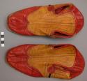 Pair of red and yellow shoes