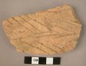 Ceramic body sherd, coarse red ware, incised ornamentation