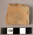 Clay plaque fragment
