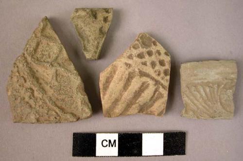 4 potsherds - gray ware, moulded relief