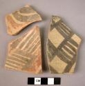 Ceramic rim and body sherds, 2 black and red on buff, 1 black on buff