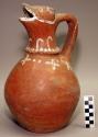 Earthenware effigy pitcher with polychrome designs on exterior