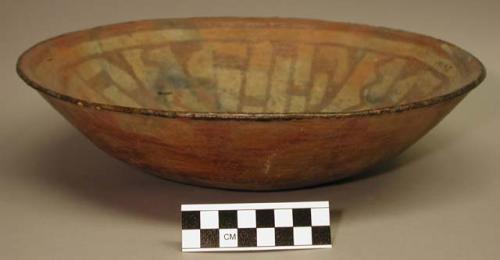 Earthenware bowl with polychrome designs on interior and exterior