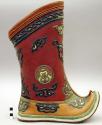 Boot with upturned toe, one of pair
