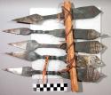 5 pointed iron blades fastened between 2 sticks - imitation of old "iron money"