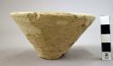 Ceramic partial bowl, undecorated white ware, splayed sides, mended