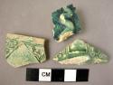 Potsherds (3) with greenish glaze.