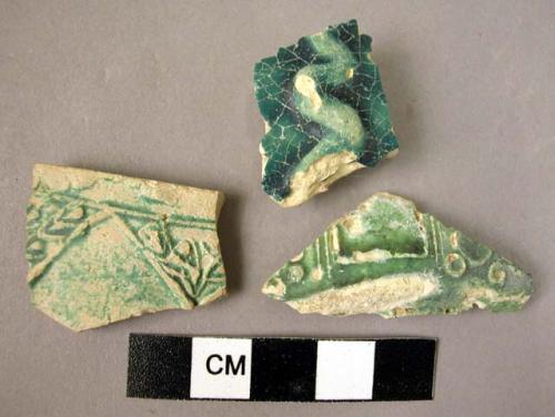 Potsherds (3) with greenish glaze.