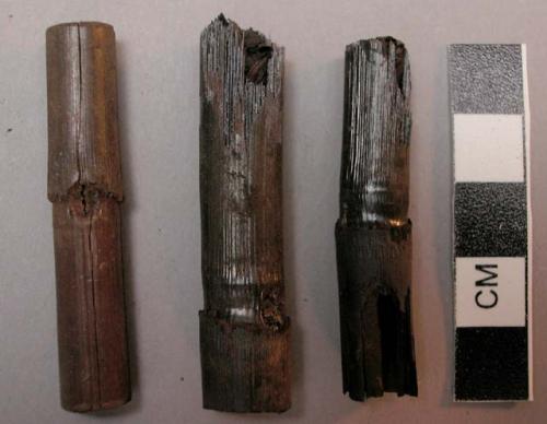 Cane cigarettes, charred, in large glass jar, corked