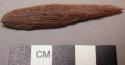 Piece of ironwood, sharpened, pointed end. l: 5.9 cm.