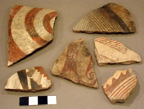 Ceramic body sherds, red on white, spiral and geometric designs