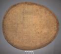 Woven straw dish with cow dung plastered on back - 2' 2" long +