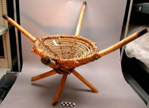 Chair, cone shaped basket attached to 4 sticks by fibre coiling (mbatasameri)
