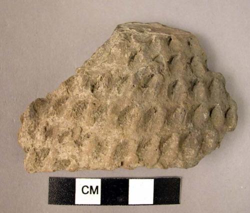 Ceramic body sherd, coarse brown ware, impressed