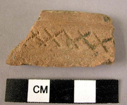 Rim potsherd - red-brown, incised