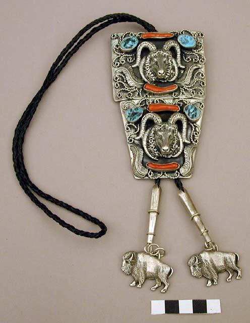 Bolo, 2 oxidized silver shields w/ ram's heads, inlaid stone, buffalo cord ends