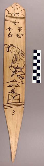 Ornament?, flat stick, black painted designs - human w/no hands showing