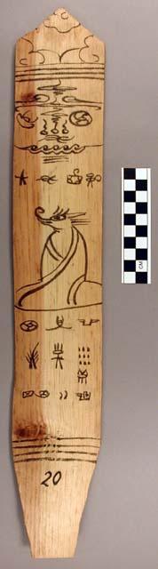 Ornament?, flat stick, black painted designs - seated cloaked zoomorph