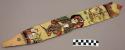 Ornament?, flat pointed stick, painted design - human with hands clasped.