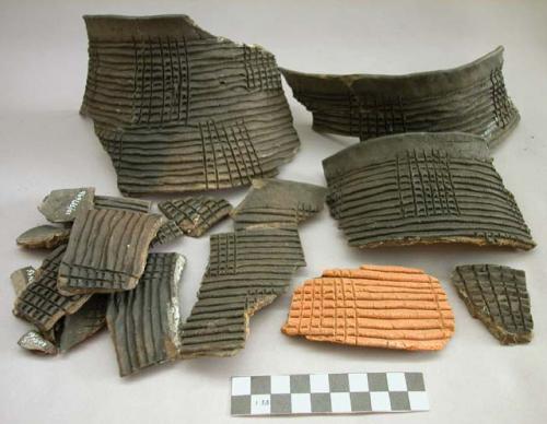 Restorable pottery vessel of 18 + sherds.