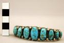 Cuff bracelet, heavy, narrow silver band set with oval turquoise stones