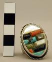 Silver ring with oval bezel set w/ mother-of-pearl, stones, & abalone