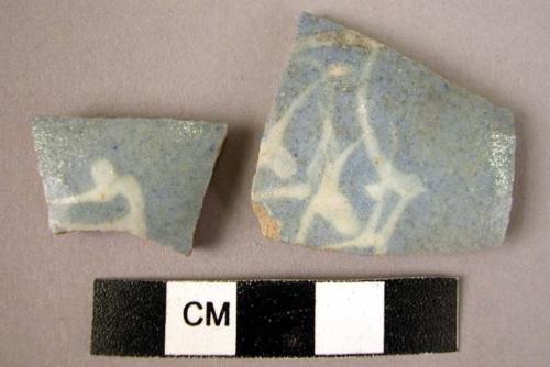 2 potsherds - white on light blue glaze