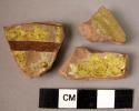 3 potsherds - brown and yellow paint (Cf. Dak)