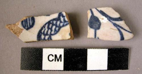 2 potsherds - blue on white glaze