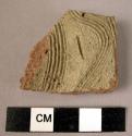Potsherd - light colored, buff slipped, incised