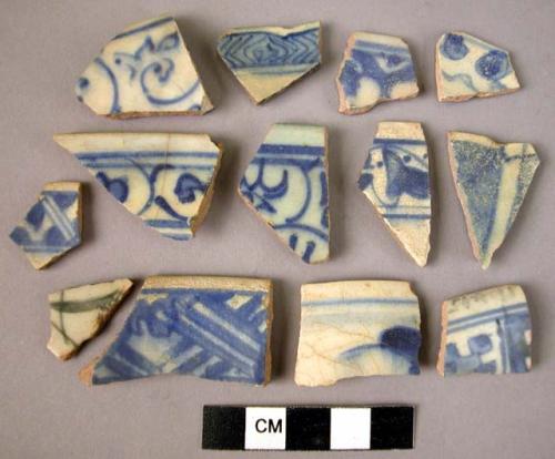 13 rim potsherds - blue on white glaze; Persian