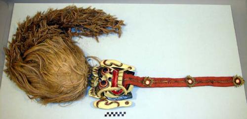 Wood mask, white with red, gold, and black painted details, large ears and fangs