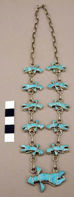 Necklace, silver chain linking 12 small & 1 large "flying men", turquoise inlay