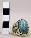 Ring, silver, 1 oval turquoise stone in a platform setting w/ silver leaves