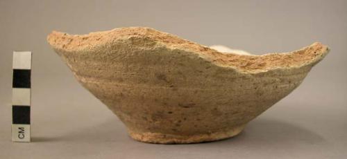 Ceramic partial bowl, coarse ware, white slipped, string cut base, splayed sides