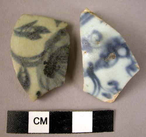 2 potsherds- blue on white glaze