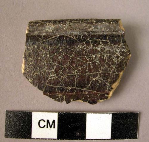 Rim potsherd - manganese brown