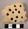 Potsherd - light colored, incised and perforated