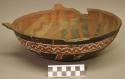 Earthenware bowl with cord-impressed and polychrome designs on exterior and polychrome designs on interior
