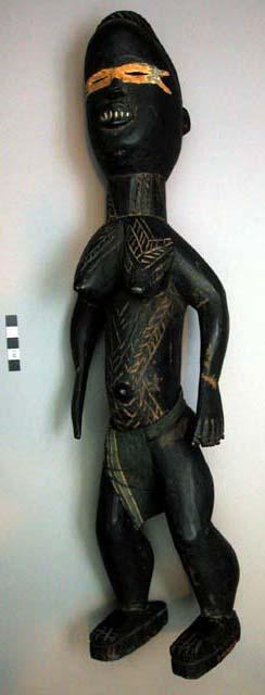 Wooden figure of woman made for tourist trade