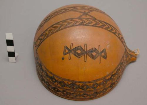 Gourd drinking cup - ornamented geometrically with red hot arrow