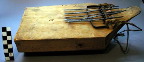 Musical instrument with sounding board and iron keys