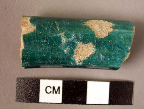 Fragment of green glazed pottery handle