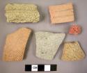 9 potsherds with grooving or incised decoration